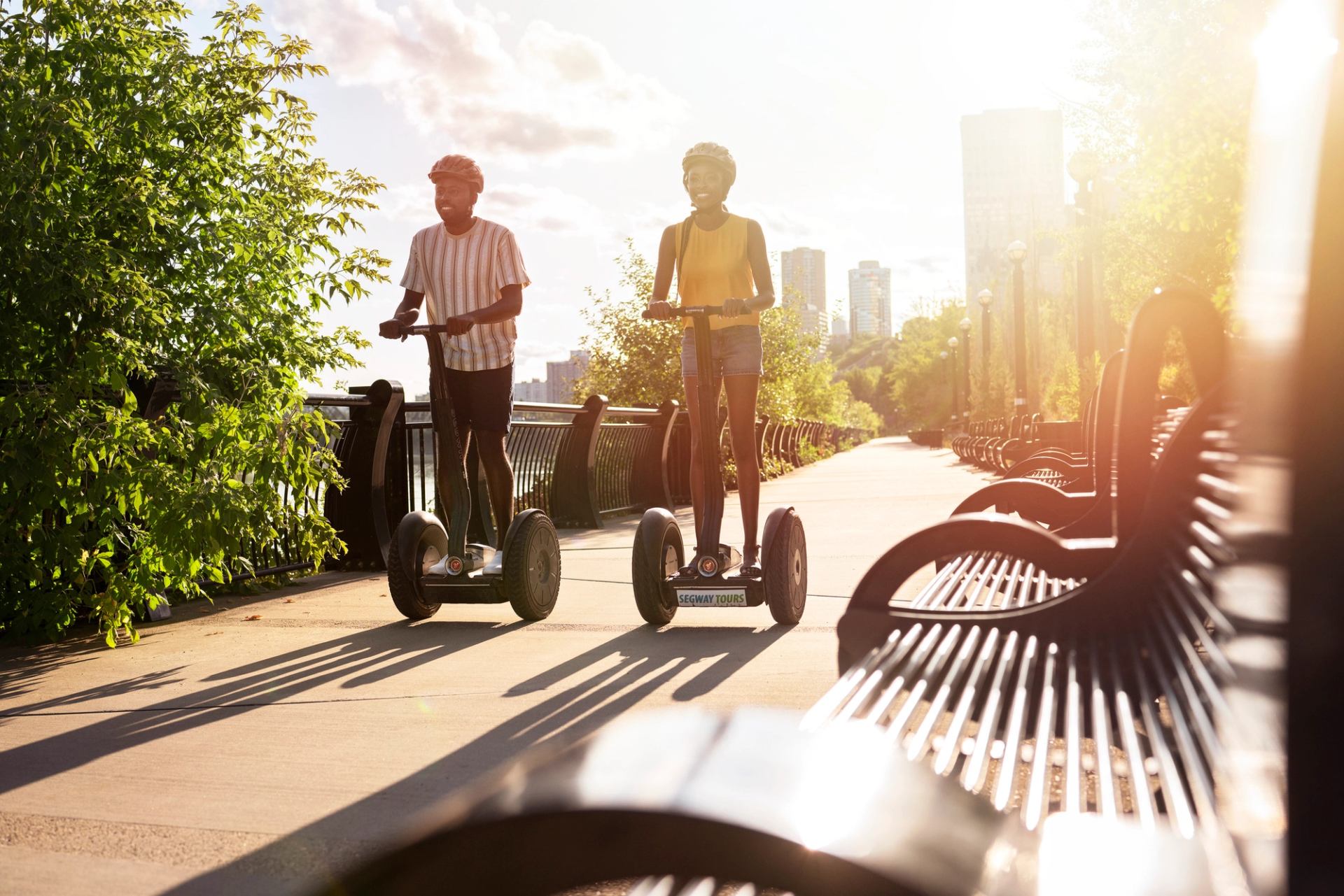 Couple on segways driving down a path