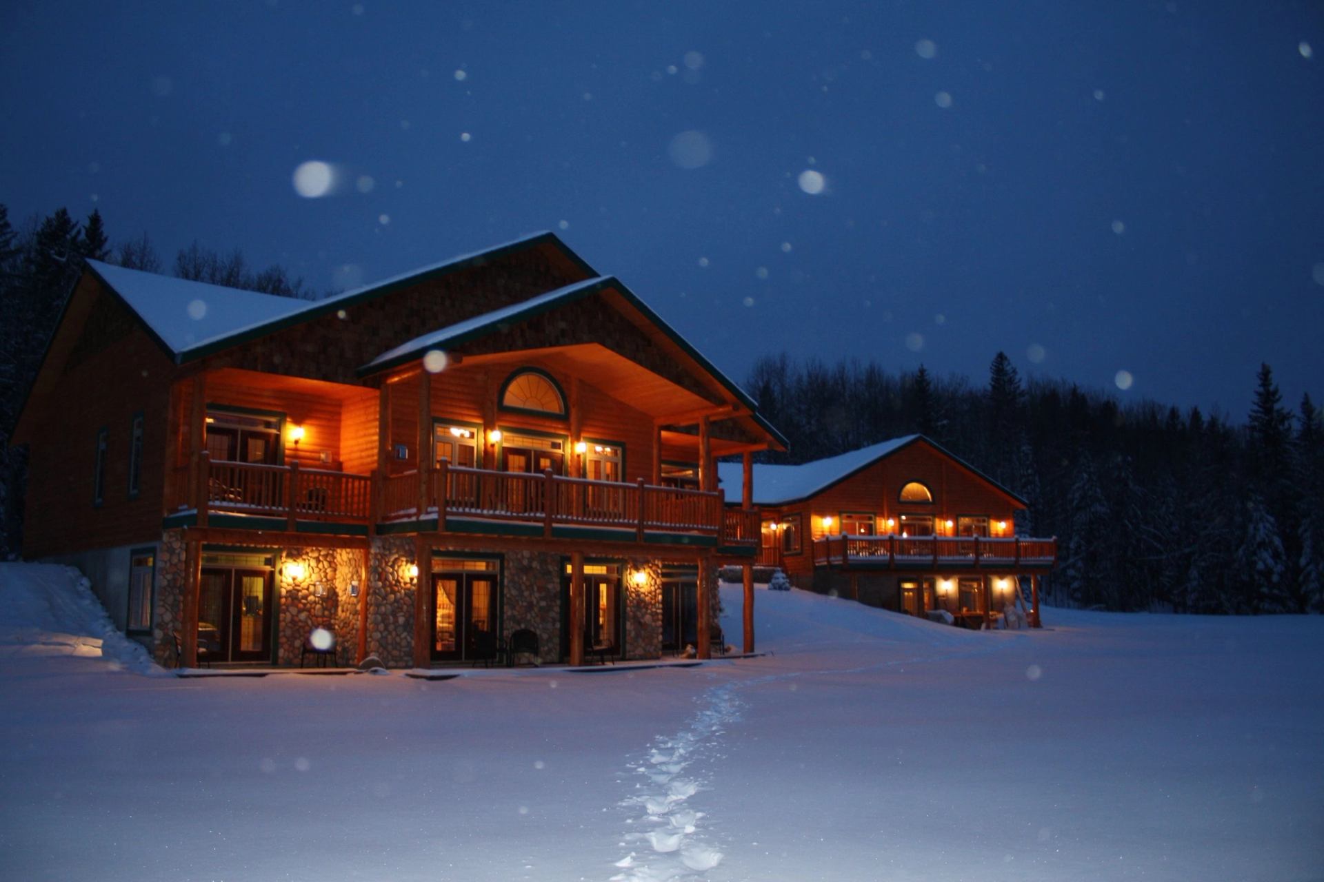 Exterior of Prairie Creek Inn during a snowfall.