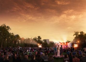 People dancing in the crowd at the Calgary Folk Festival at sunset.