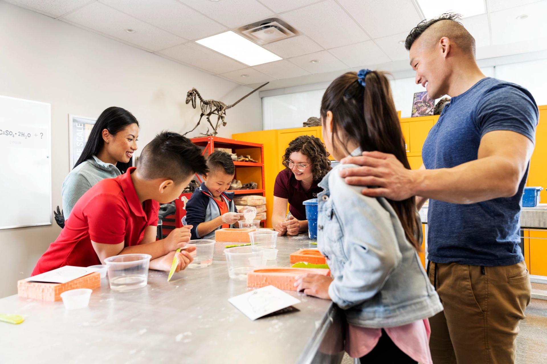 Kids working on the fossil casting- interactive activity at the Royal Tyrrell Museum in Drumheller