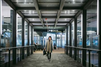 Female walking through the Edmonton International Airport