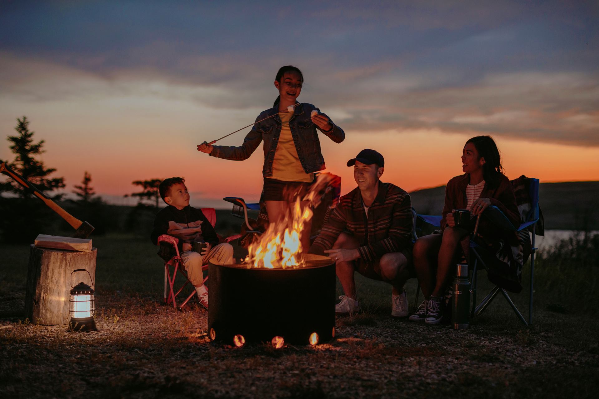 Family around a campfire.