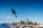 Person ski jumping with downtown Edmonton in background