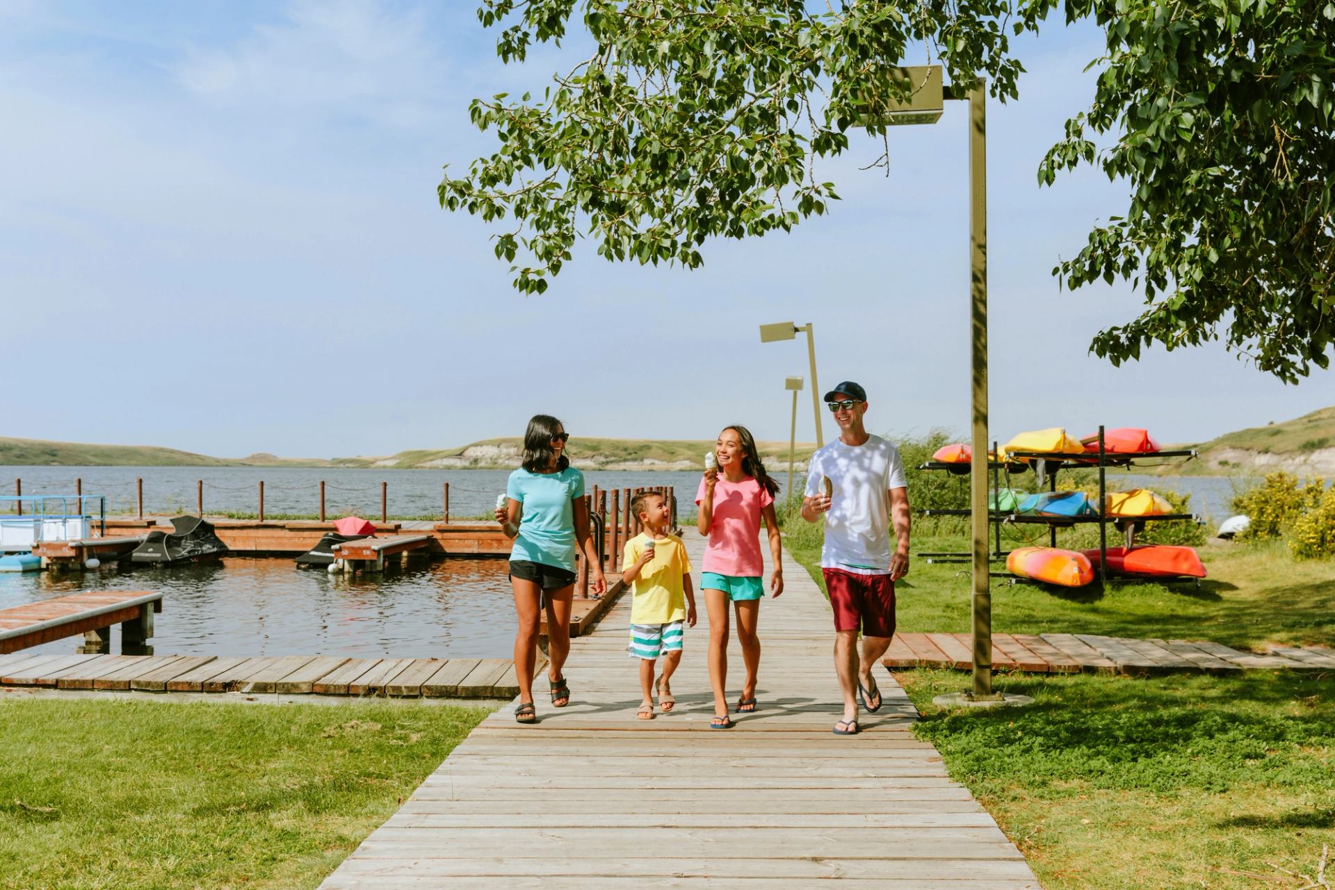 Family enjoying ice cream on the boardwalk at Cypress Lake.
