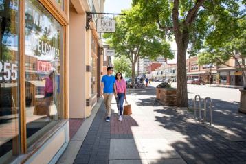 Couple walking in downtown Lethbridge