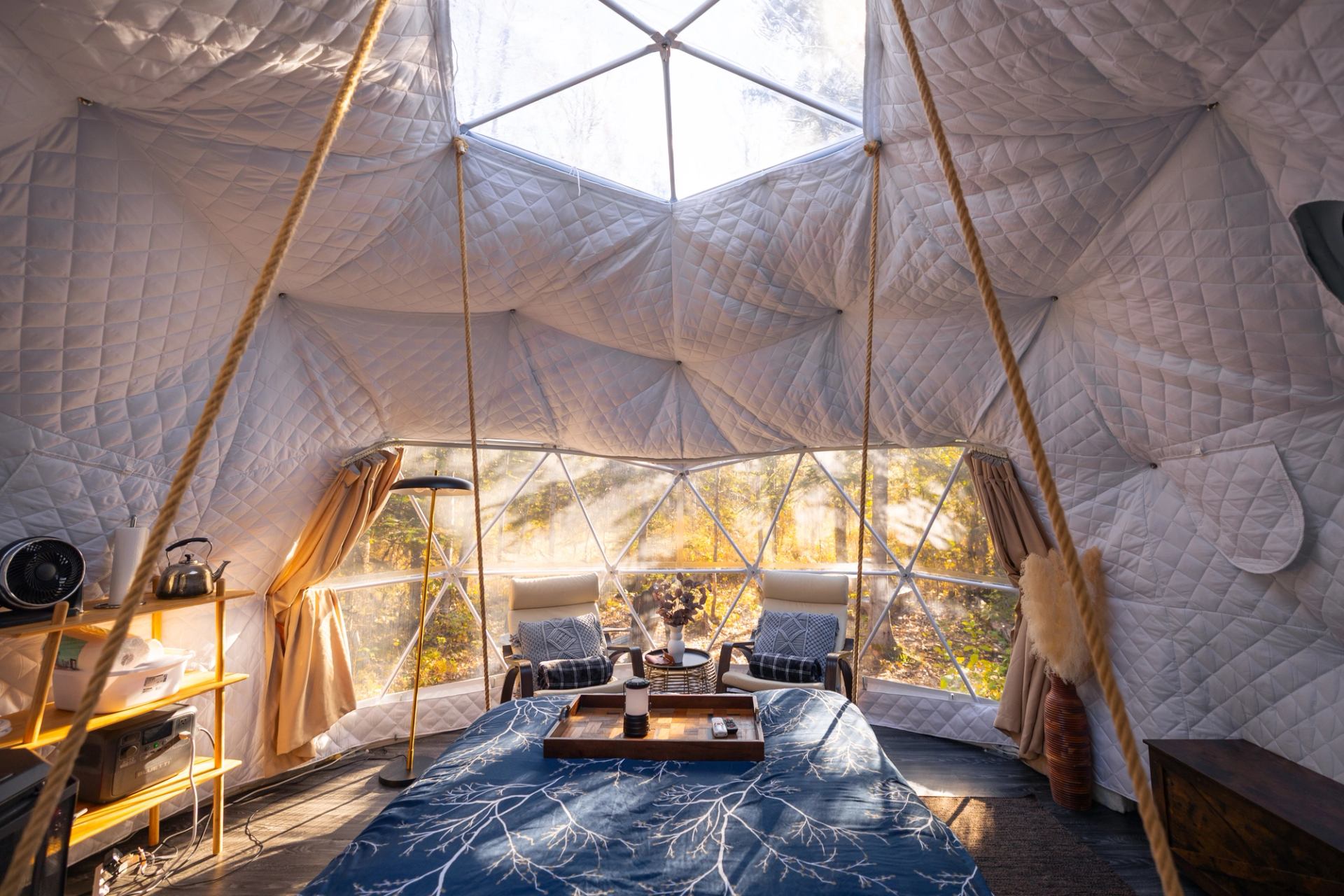 The cozy interior of a luxury glamping dome at Glamp Good in Alberta.