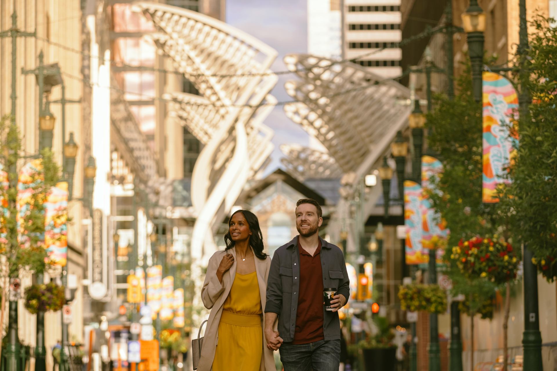 Couple walking down Stephen Avenue in downtown Calgary