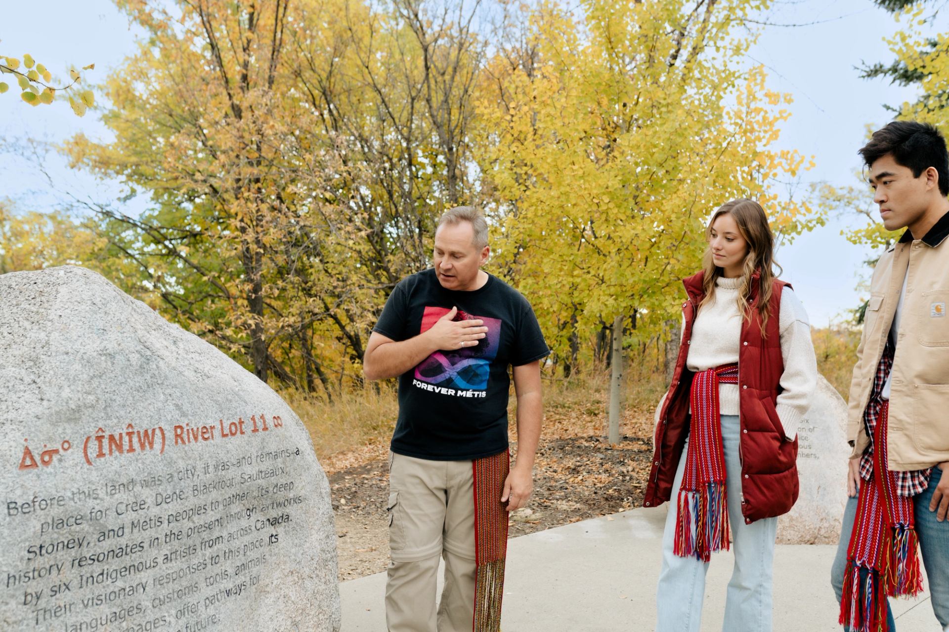 A guide shares Indigenous history and culture with guests on a Talking Rock Tour in Edmonton.