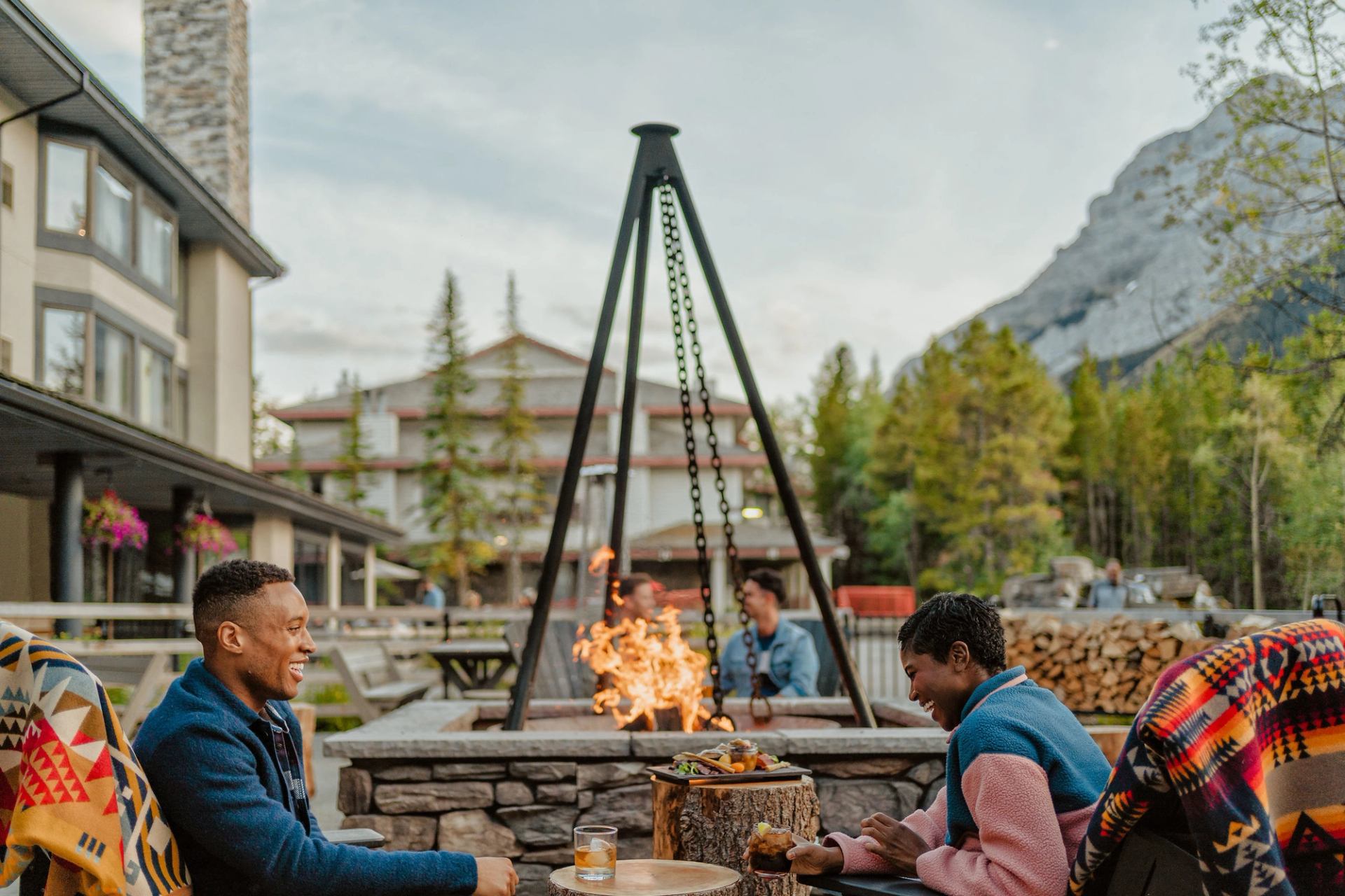 People enjoying food at a restaurant at the Pomeroy Kananaskis Mountain Lodge