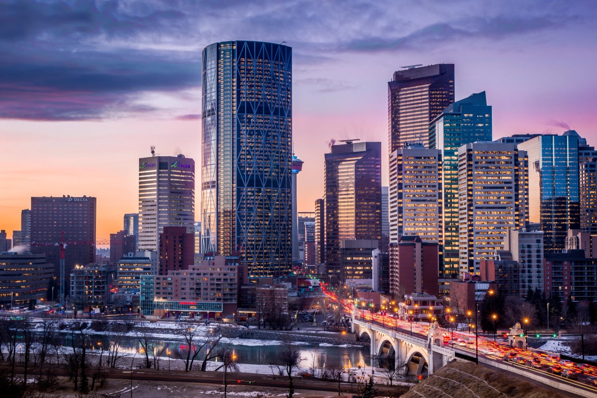Downtown Calgary at sunrise lit by winter lights.