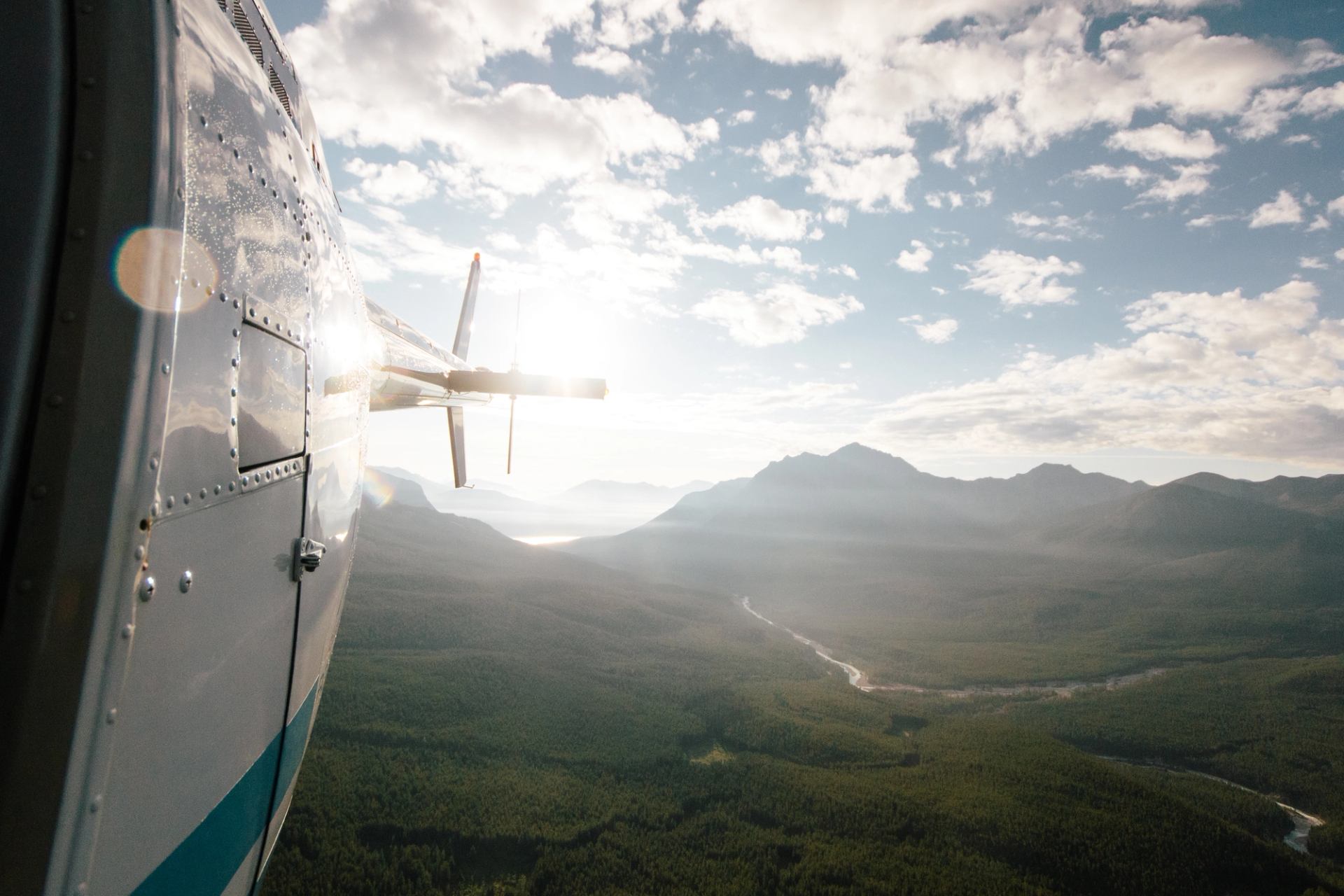 Close-up view of a helicopter against the sun in the Rocky Mountains