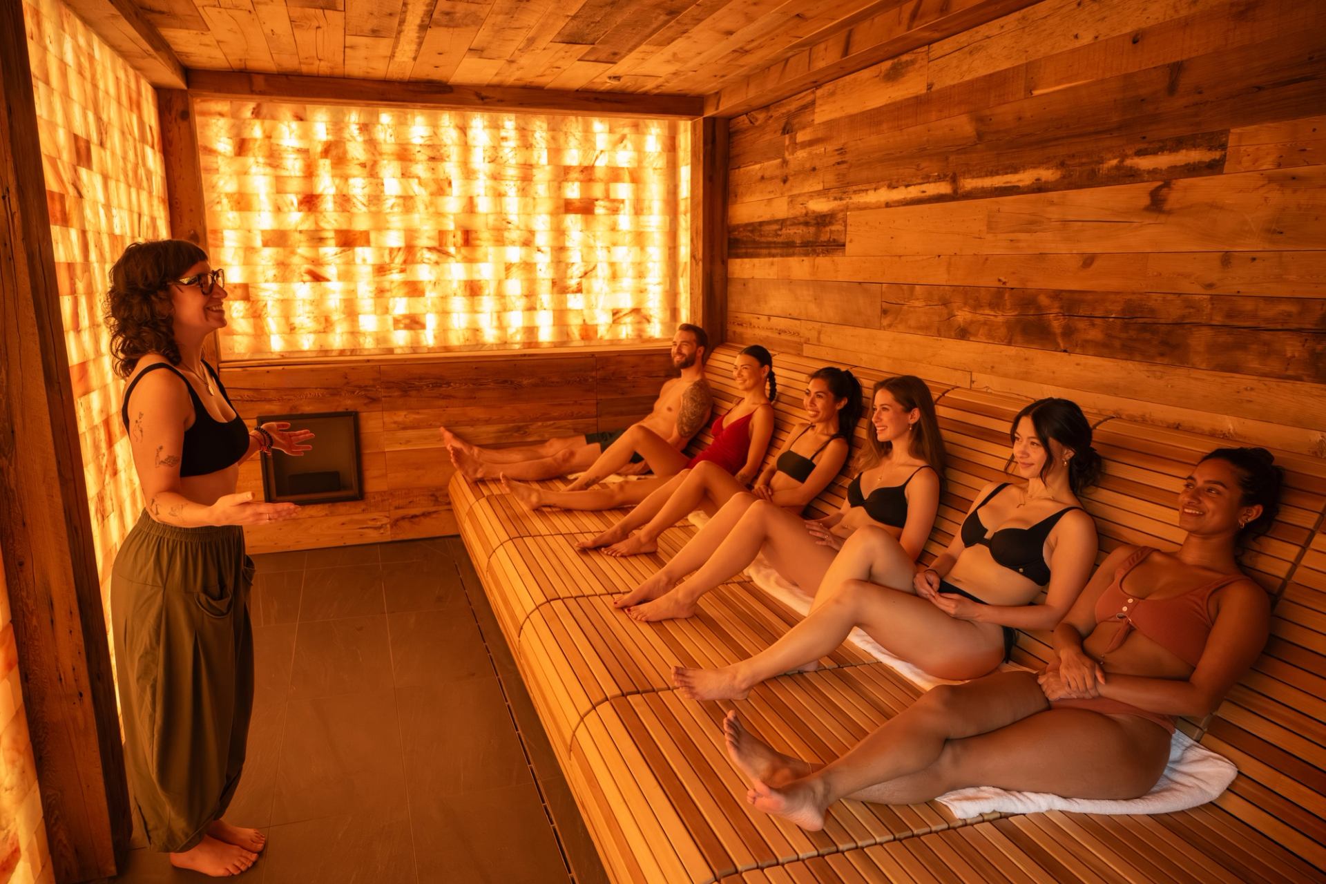 A group of people relax in the salt lodge at Everwild Canmore.