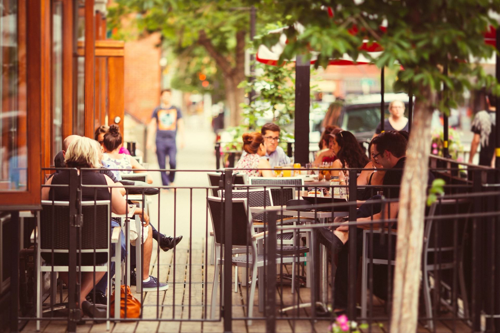 People dining on an outdoor patio in the Kensington neighbourhood in Calgary.