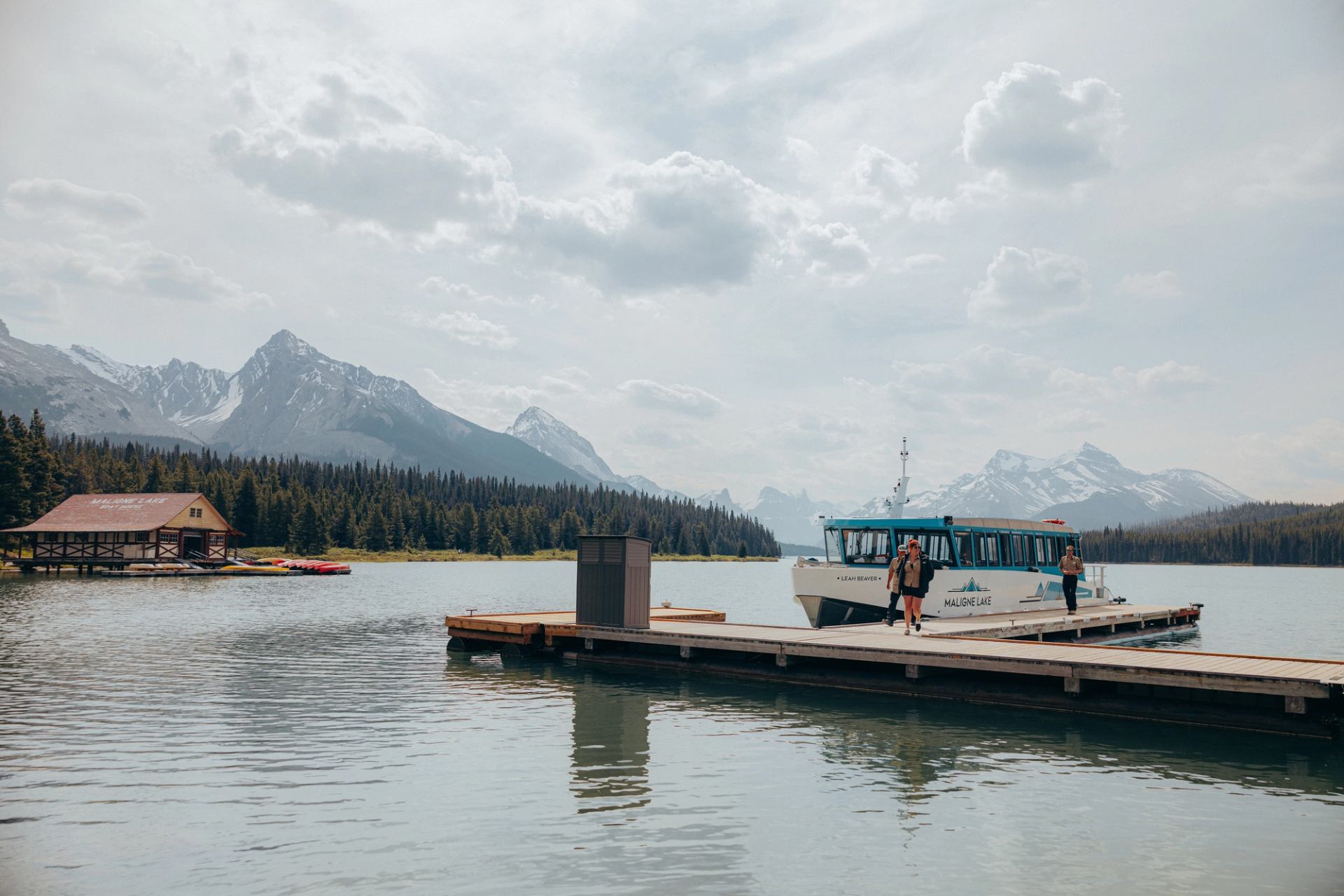 People getting off a Maligne Lake Tour boat on the dock