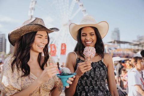 Stampede-goers enjoy food at the midway.