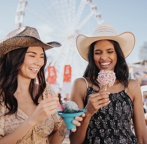 Stampede-goers enjoy food at the midway.