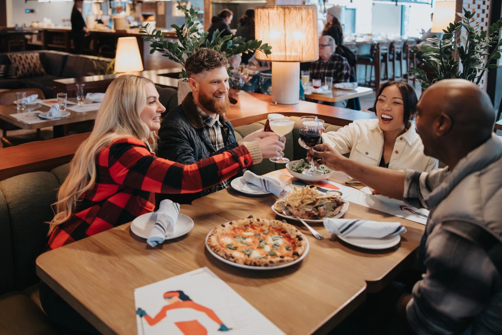 A group of people eating at Bridgette Bar in Canmore, Alberta.