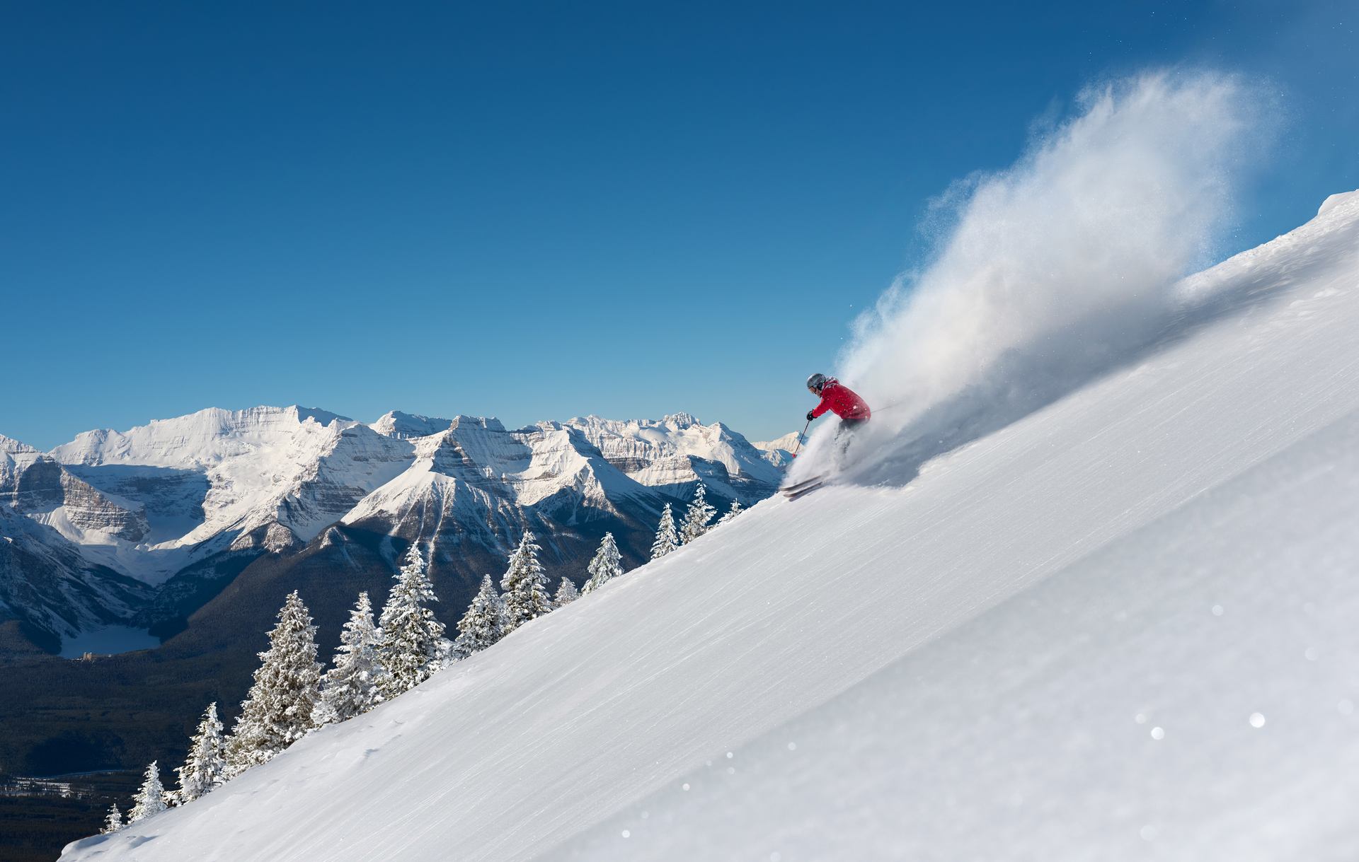 Carve fresh powder on the iconic Canadian Rockies. Lake Louise Ski Resort, Banff National Park.