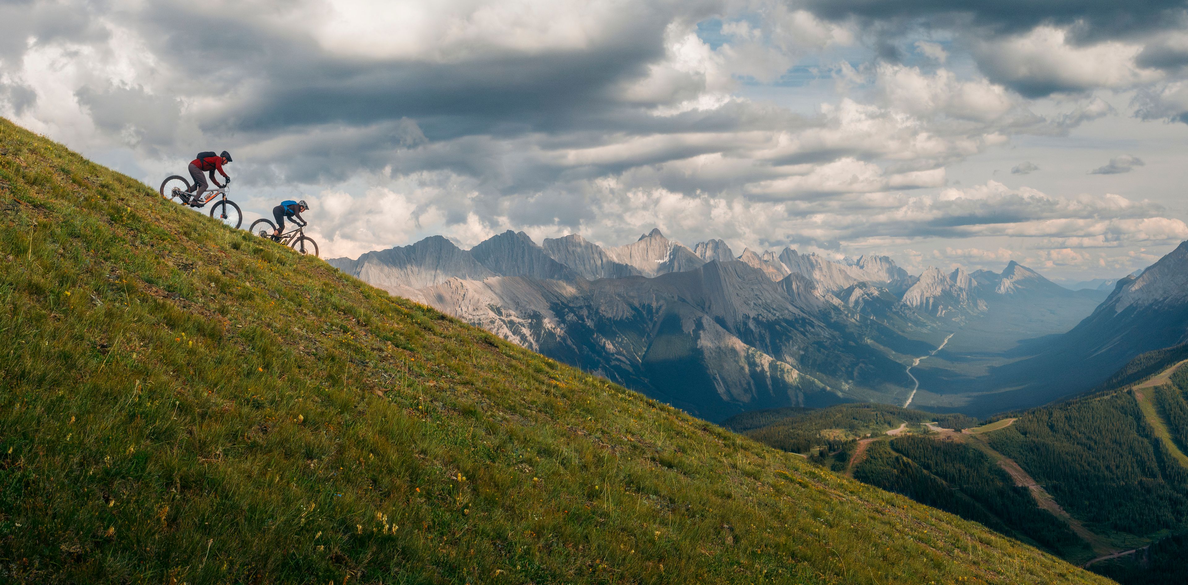 Two mountain bikers ride down Fortress Mountain.