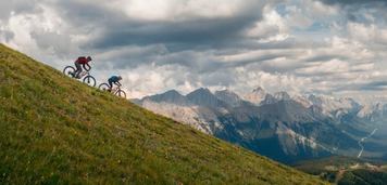 Two mountain bikers ride down Fortress Mountain.