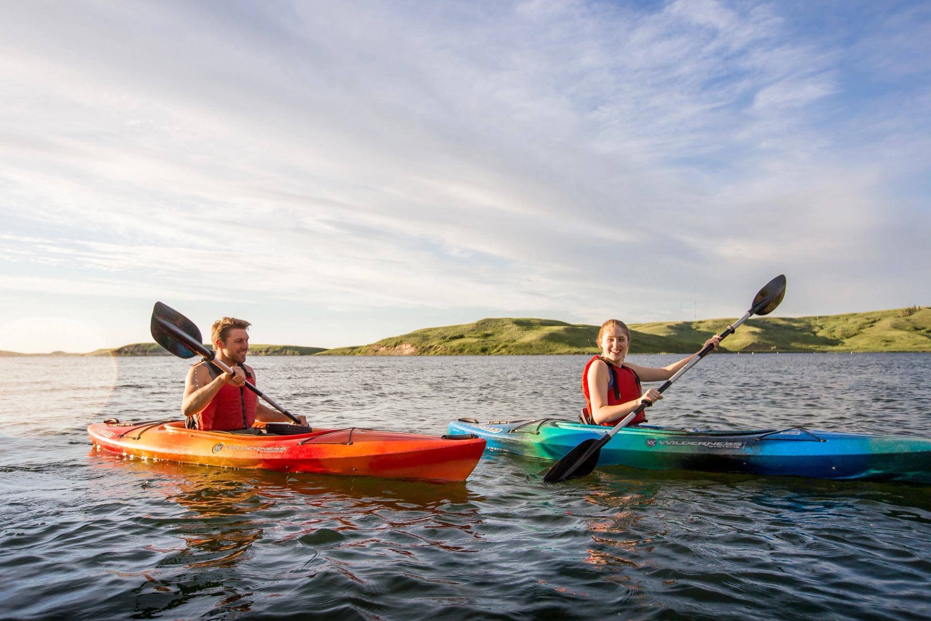 Couple kayaking on Elkwater Lake at Cypress Hills Interprovincial Park