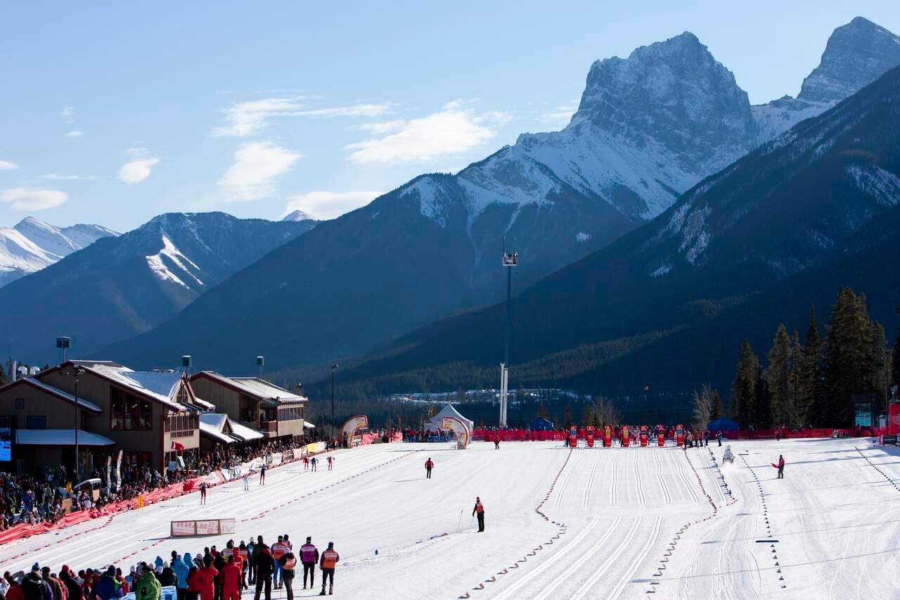 A large event complete with spectators taking place at the Canmore Nordic Centre.