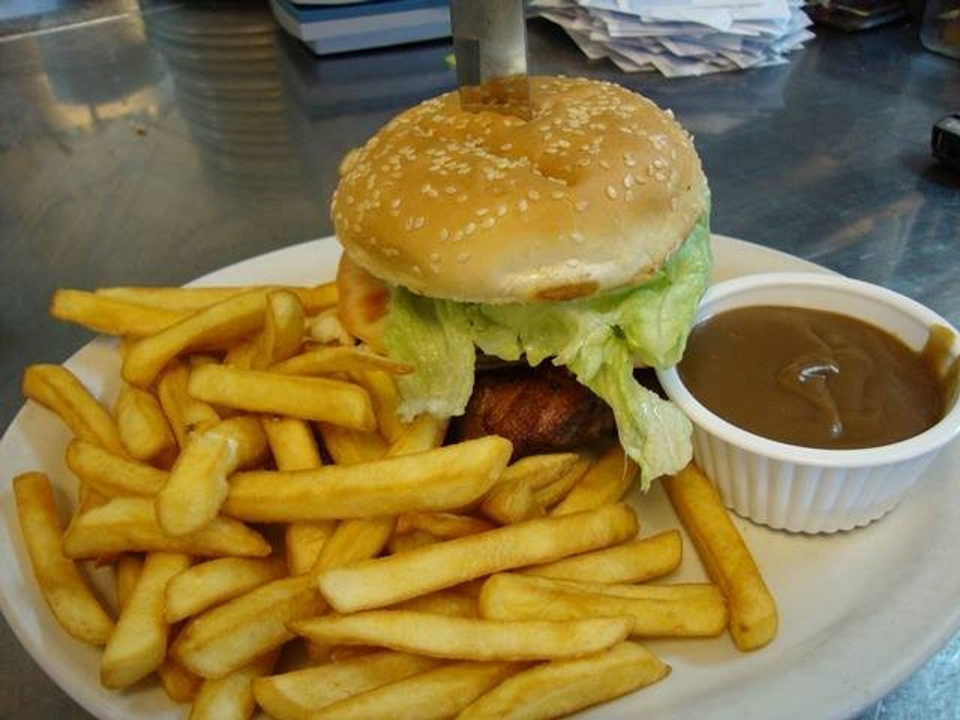 A plate with burger and fries