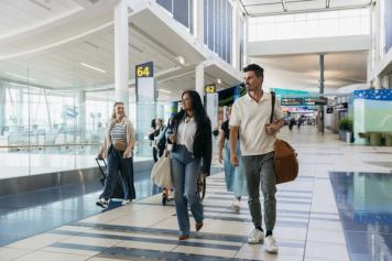 Travellers move through a concourse at Edmonton's airport.