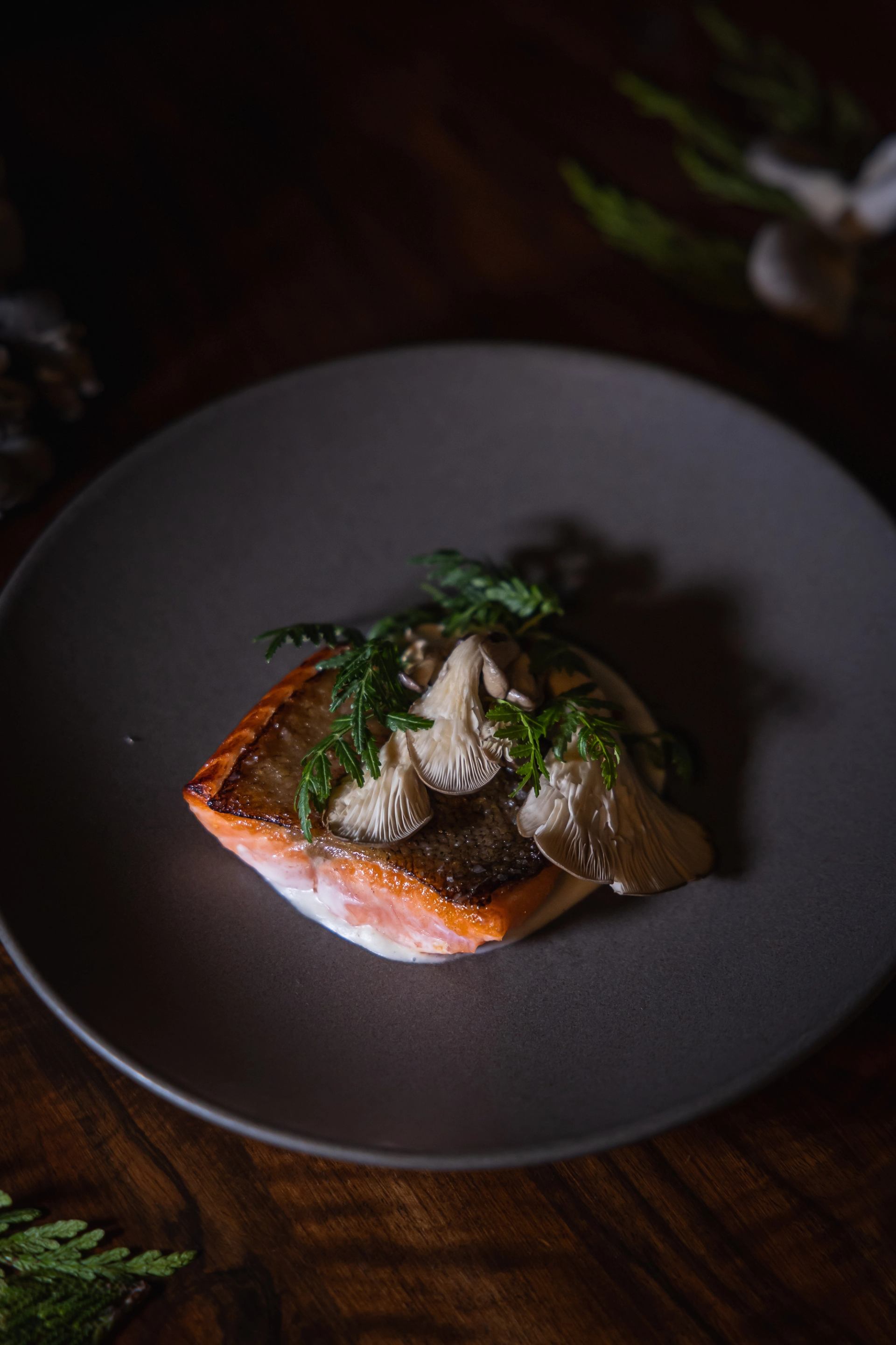 A moody shot of a salmon dish at Sauvage restaurant.
