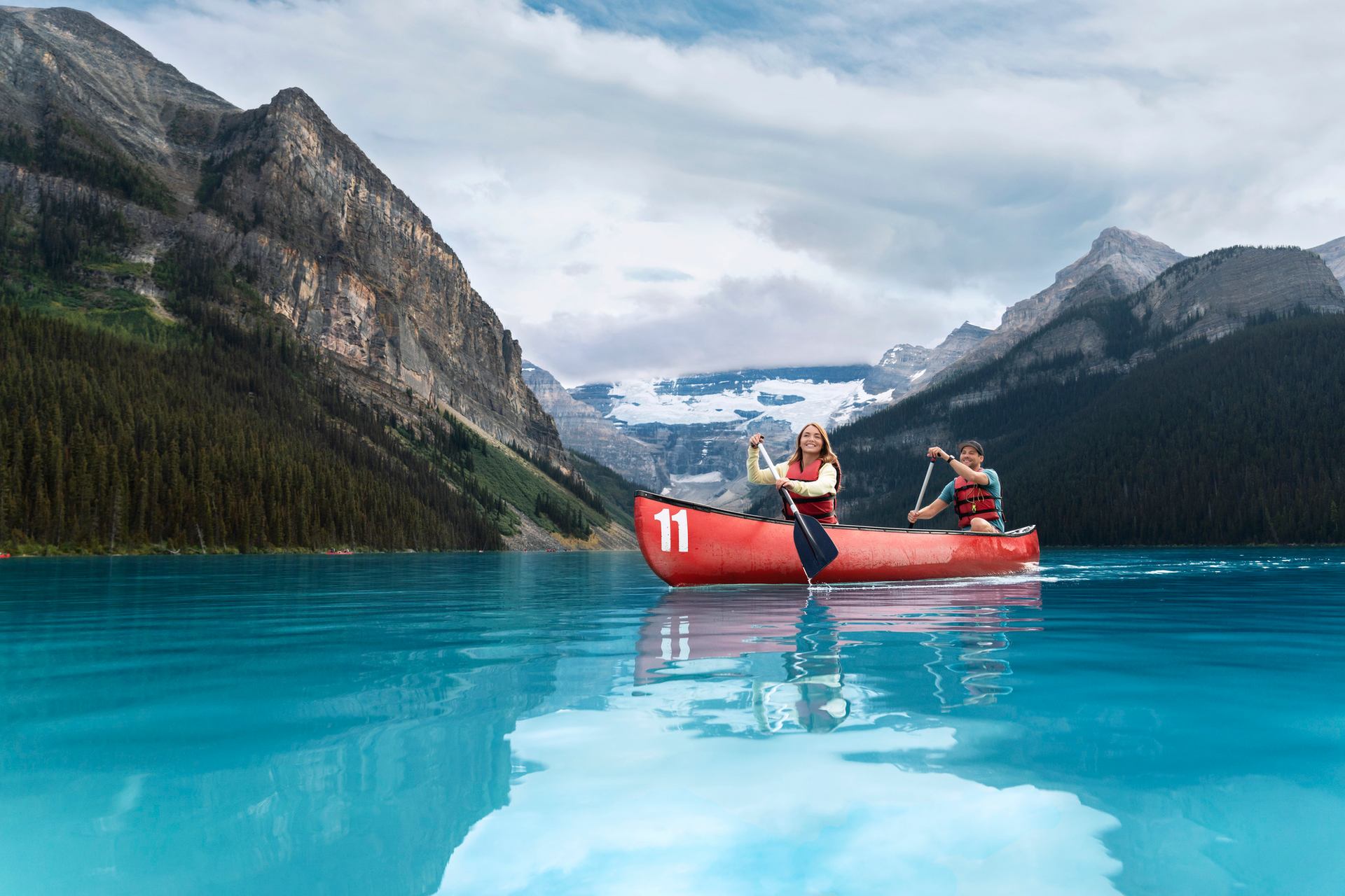 A couple canoeing at Lake Louise in Banff National Park.