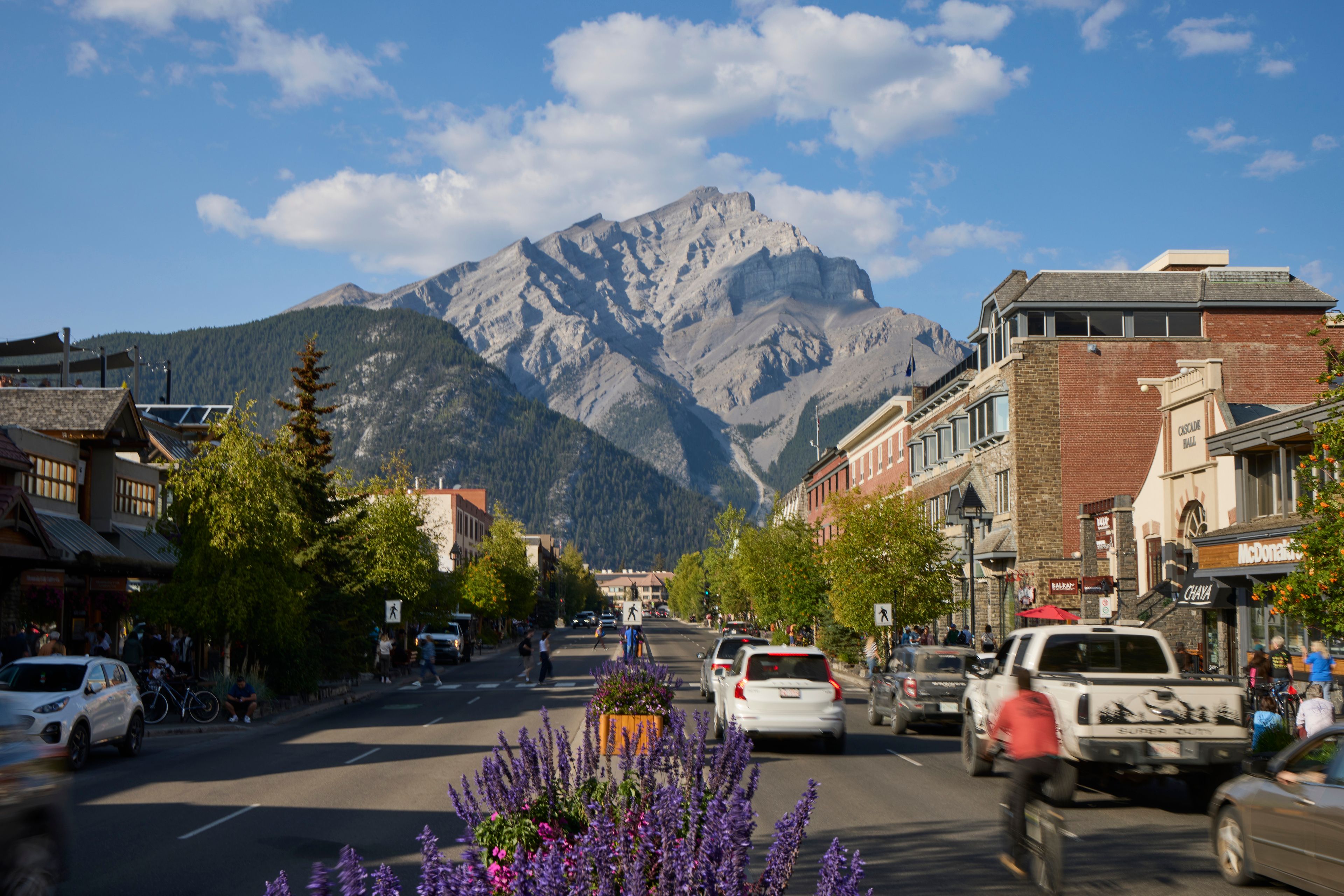 Banff Ave showing traffic and Cascade Mountain in background