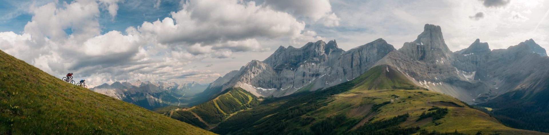 Pano shot of 2 Mountain Bikers riding down Fortress Mountain