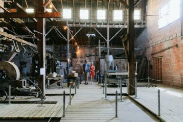 A couple walks through the historic brick-making factory in Medalta in the Historic Clay District.