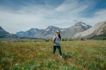 Visitors taking photos and exploring plant species during the Waterton Wildflower Festival.