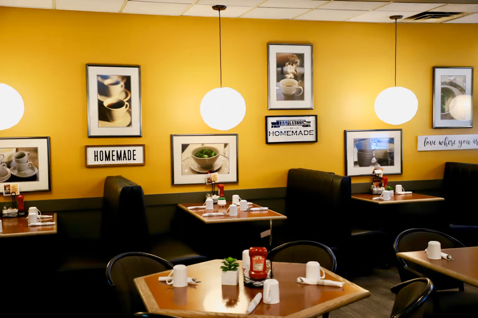 The cheery yellow interior of Monica's Family Restaurant.