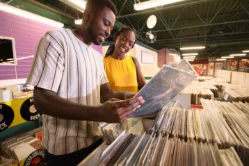 Couple looking at records in a music store