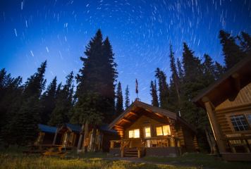 Star trails in the night sky over Shadow Lake Lodge in Banff National Park