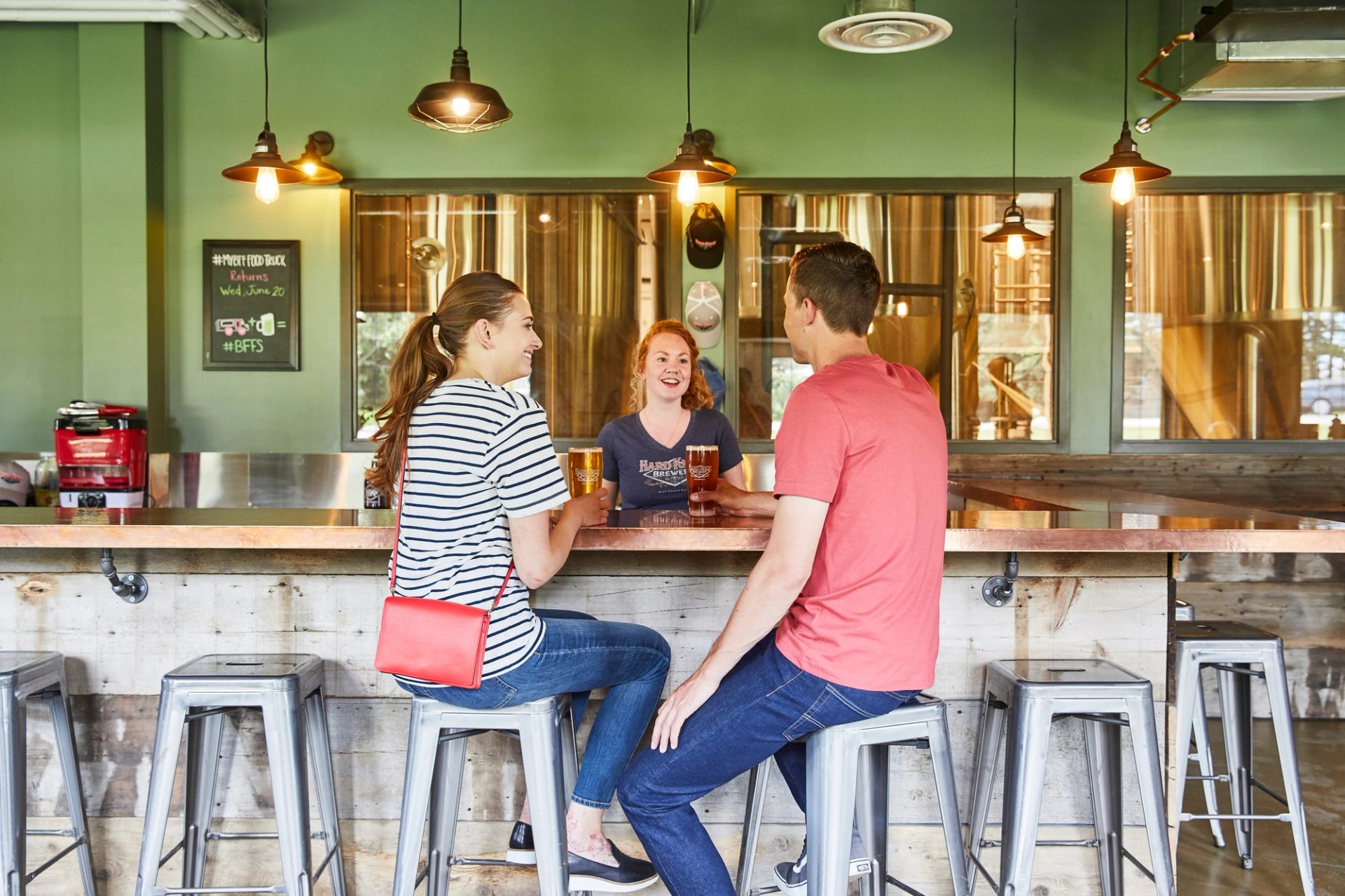 A couple having a pint of beer at Hard Knox Brewery.