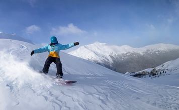 A man snowboards at Marmot Basin.
