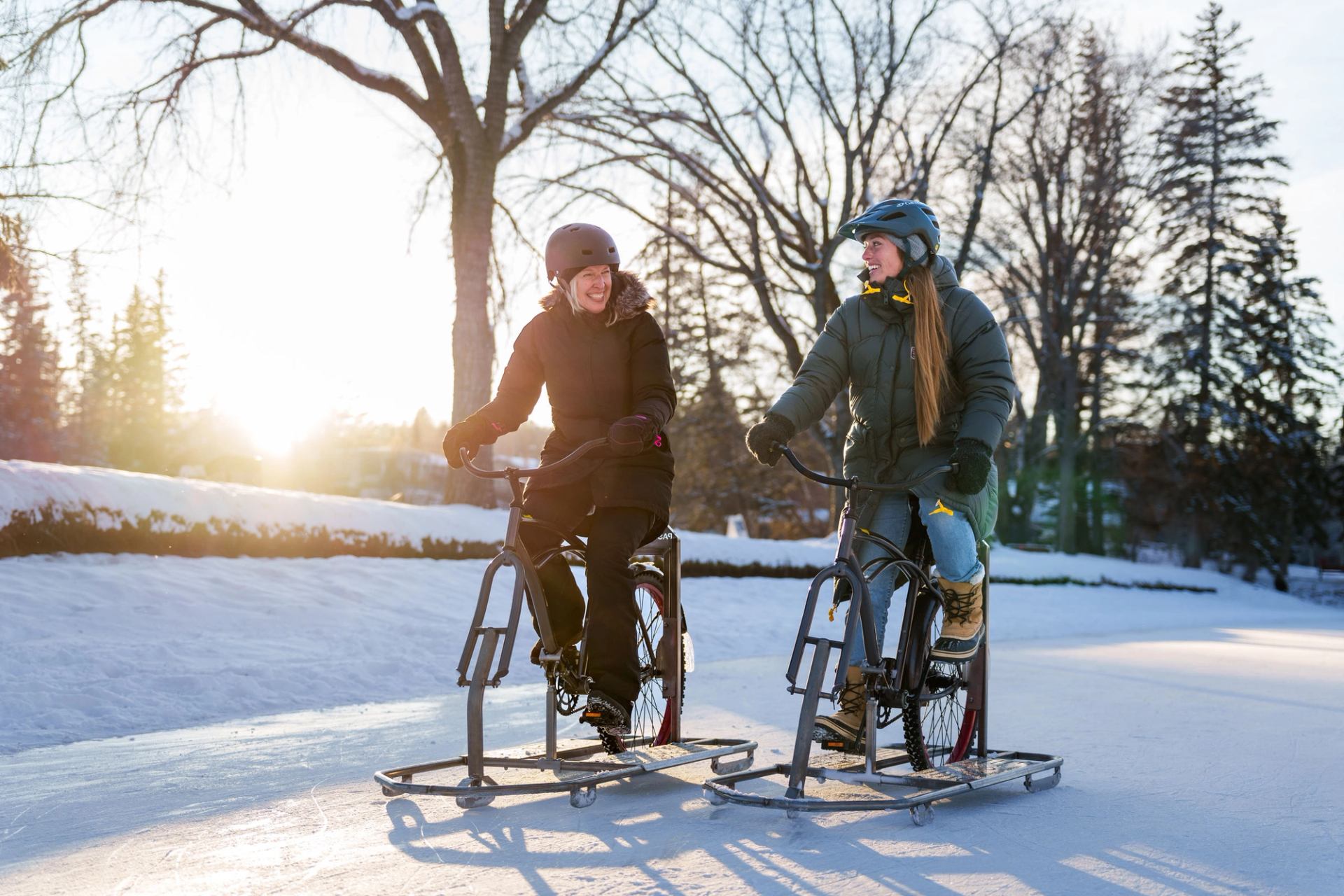 A group of friends ice biking at Bowness Park in Calgary.