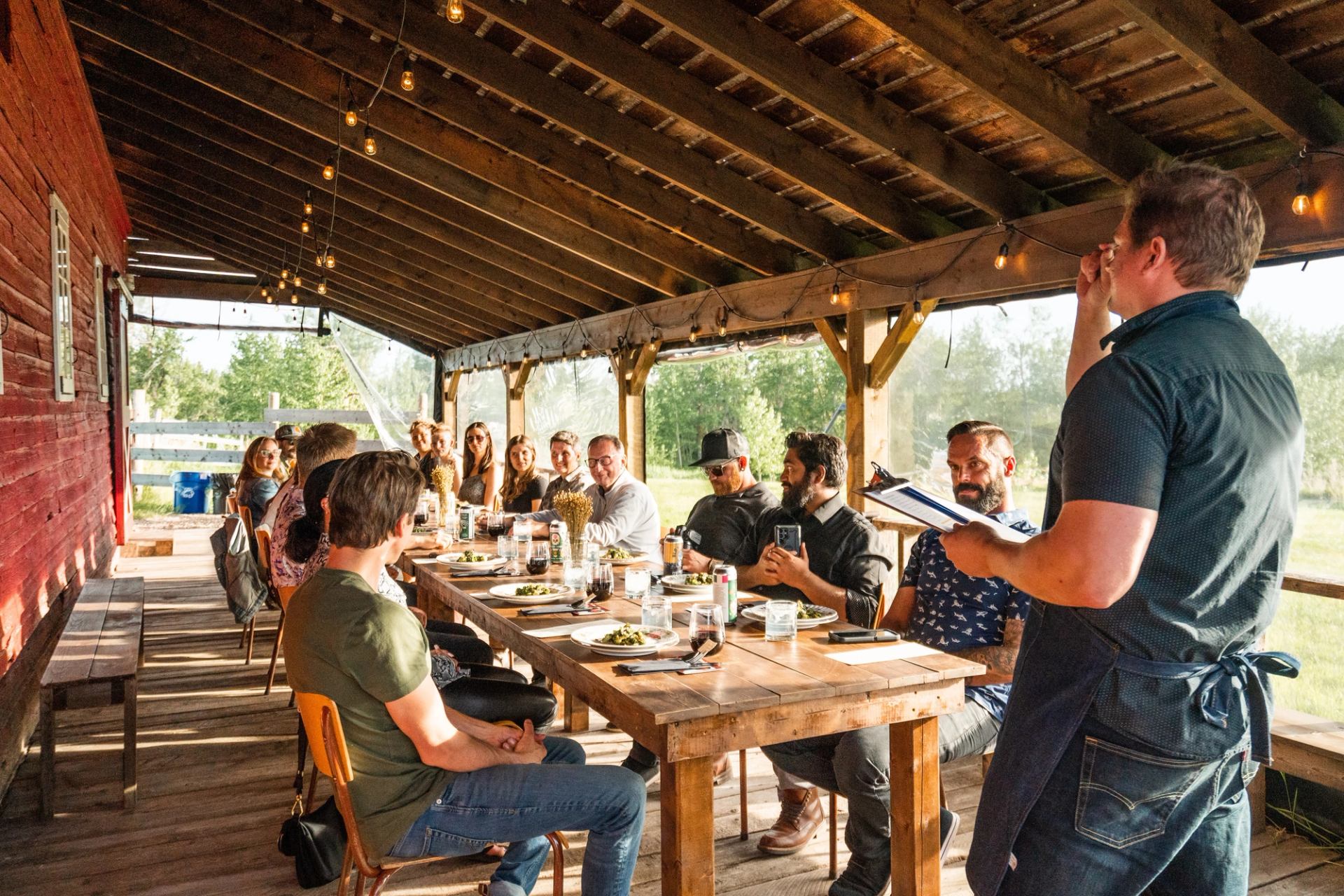 A group gathers around a dinner table.