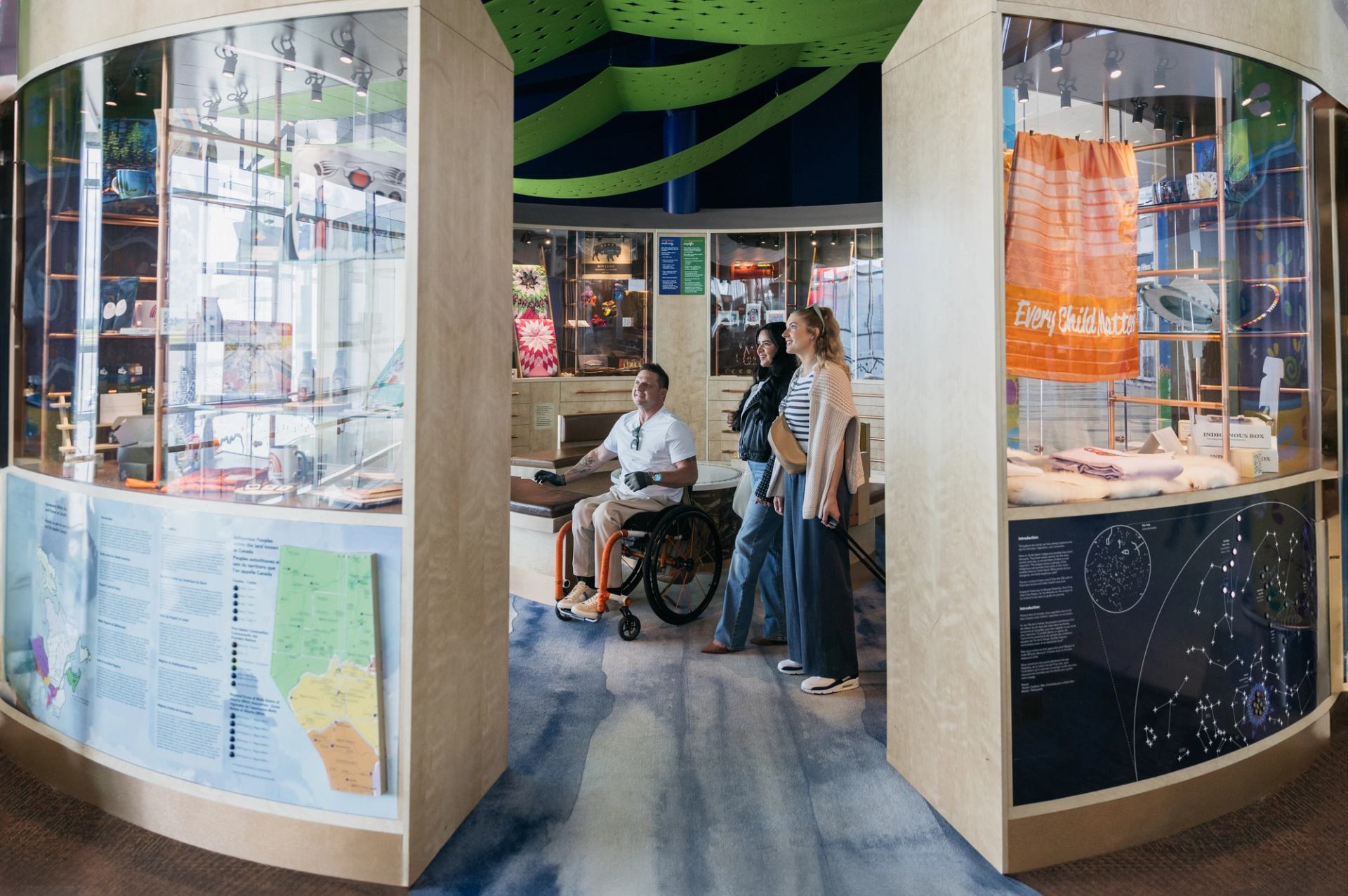 People browse an Indigenous shop and interpretive centre at Edmonton's airport.