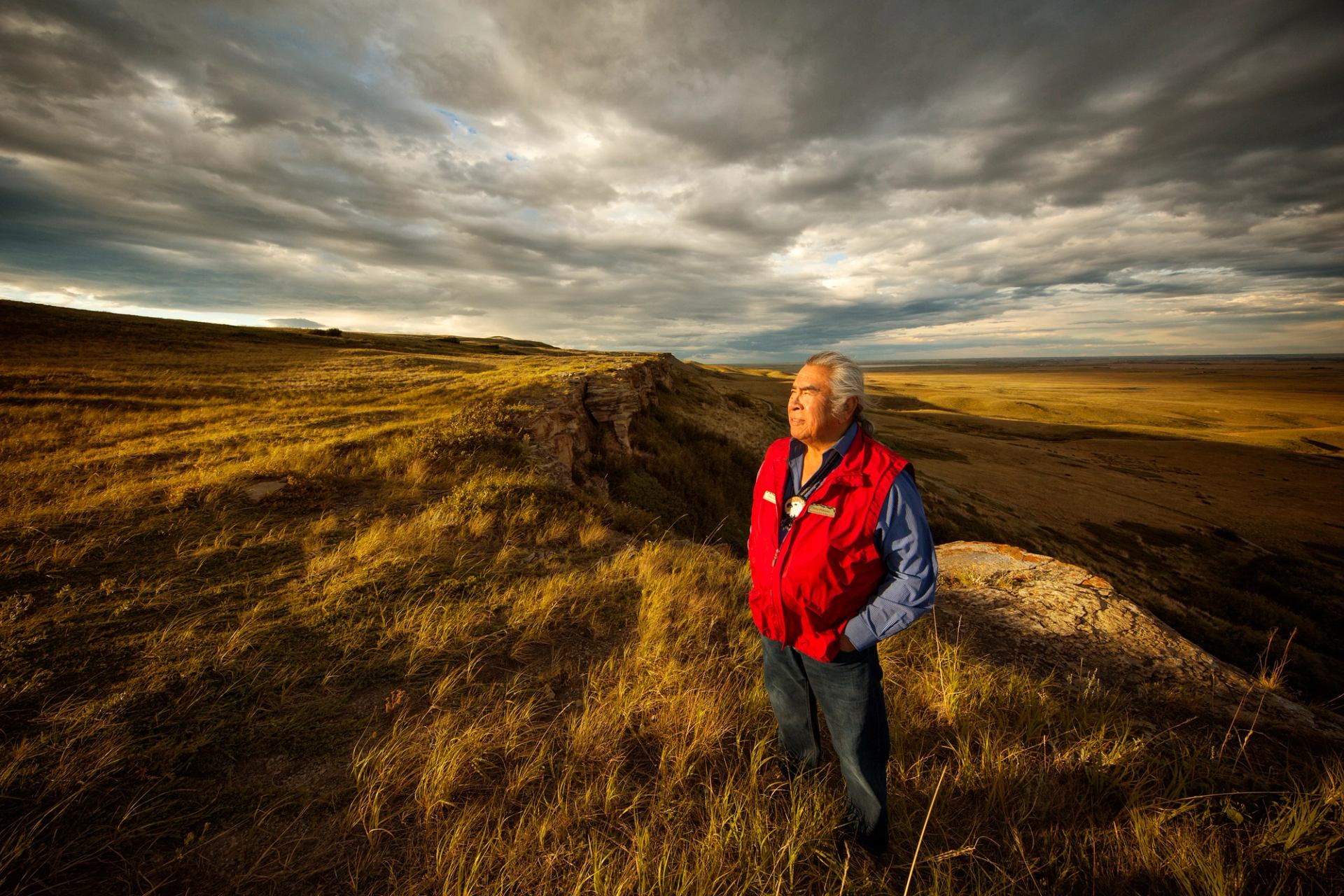 Scenic shot of an Indigenous man standing on the plains