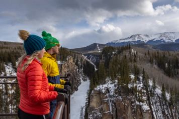 A couple take in the views of the valley below at Sulphur Gates in Grande Cache