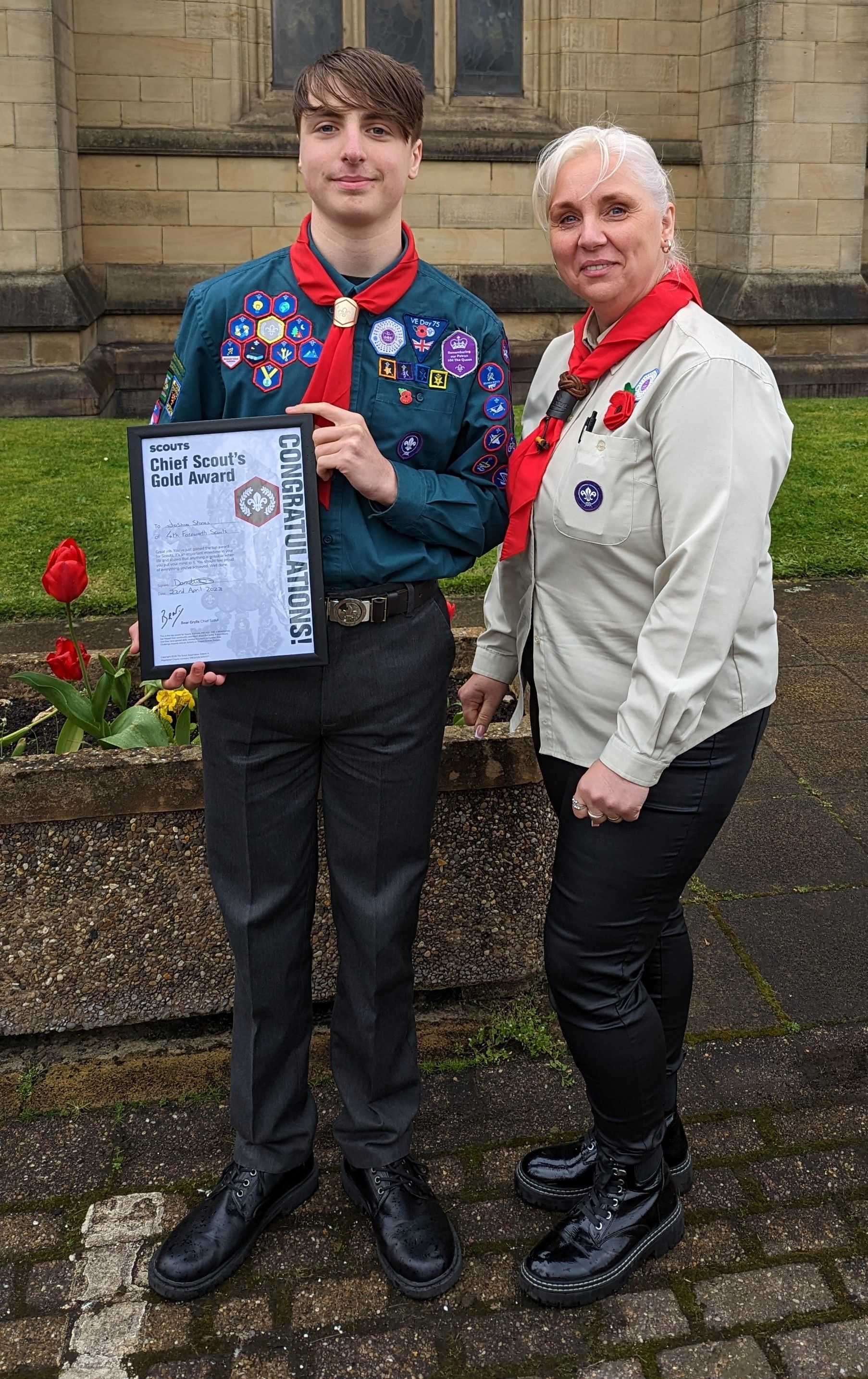 Bee Stones and a scout receiving their gold award