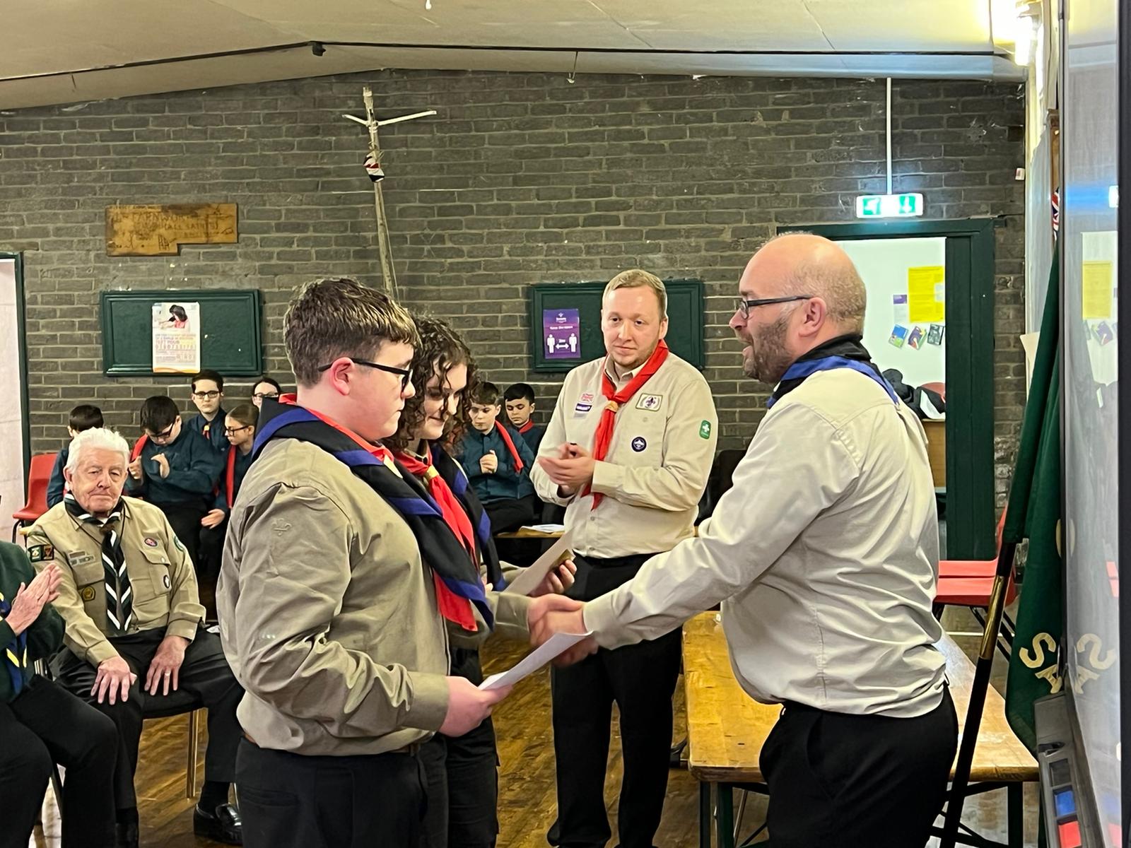 Ian handing out awards to 2 Explorers Scouts