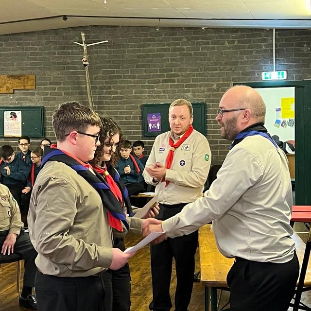 Ian handing out awards to 2 Explorers Scouts
