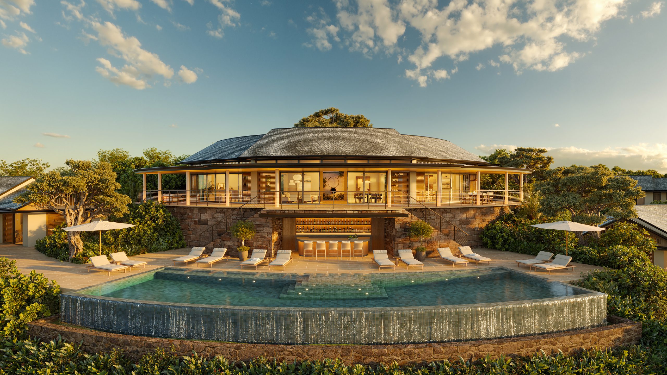 Villa with wrap-around infinity pool at sunset, designed by Mark Cooney