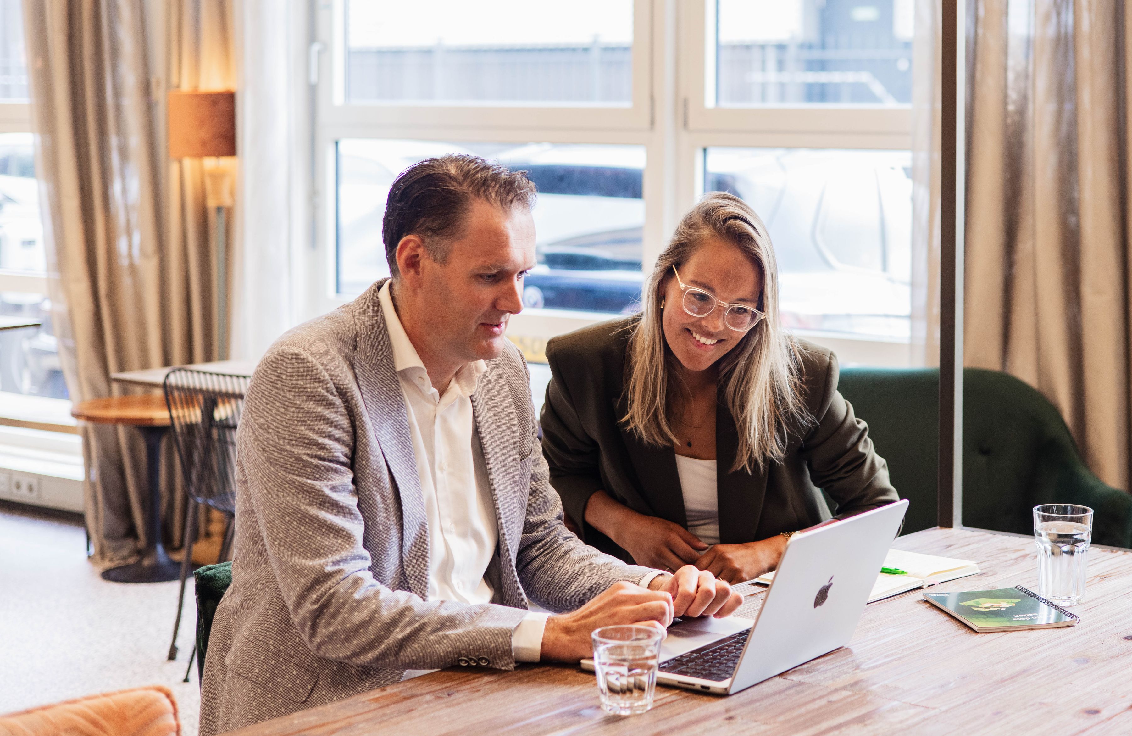 Business Manager talking to a colleague