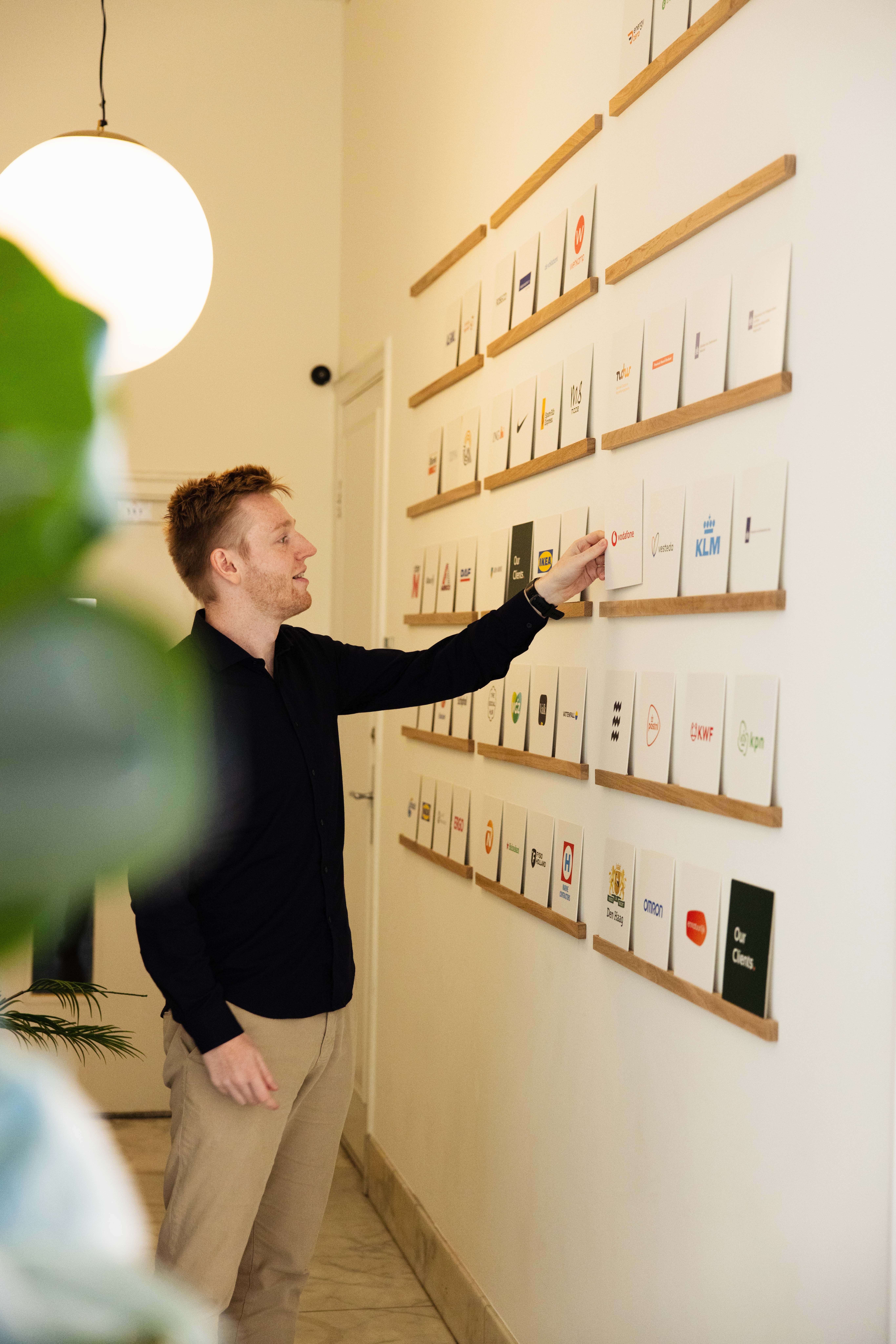 colleague with client wall